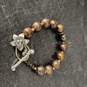 Lia Sophia brown beaded bracelet with beautiful flower clasp.